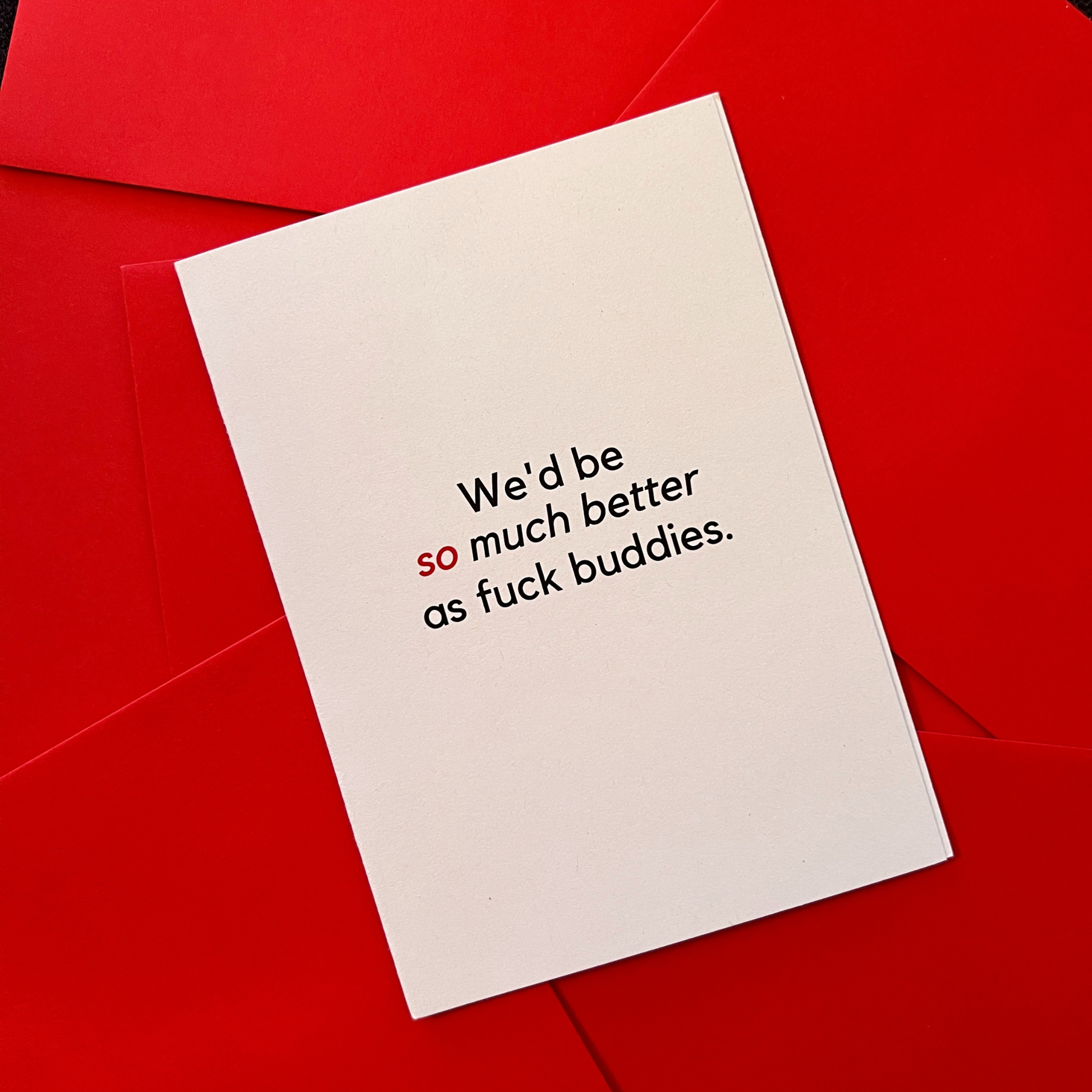 A white greeting card by The Mail Minx that says "We'd be so much better as fck buddies" in red and black text.