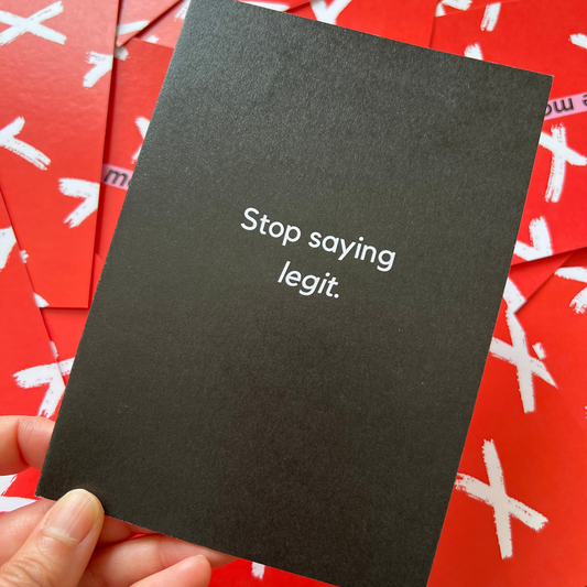A black greeting card by The Mail Minx with a message in white font that says stop saying legit
