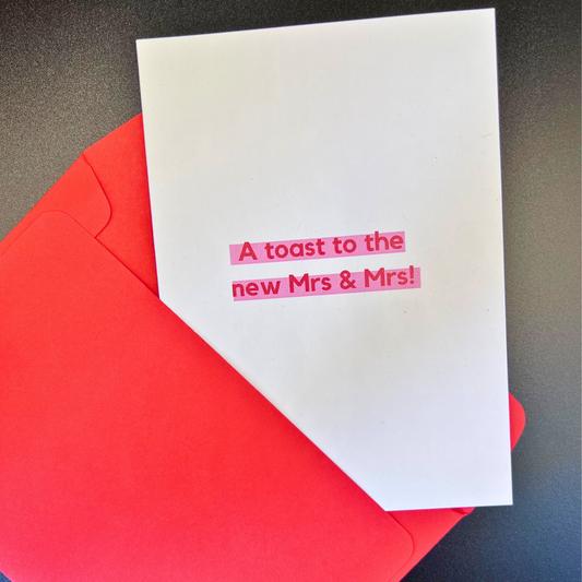 A lesbian wedding card by The Mail Minx that says a toast to the mrs and mrs