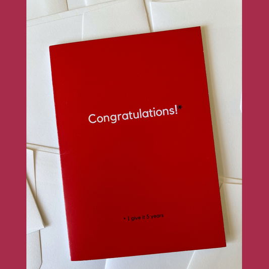 A red wedding card by The Mail Minx with the message "Congratulations! I give it 5 years." 