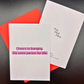 A wedding greeting card by The Mail Minx that says cheers to banging the same person for life in black text highlighted in purple. The card comes with a red envelope, and the back of the card has The Mail Minx logo.