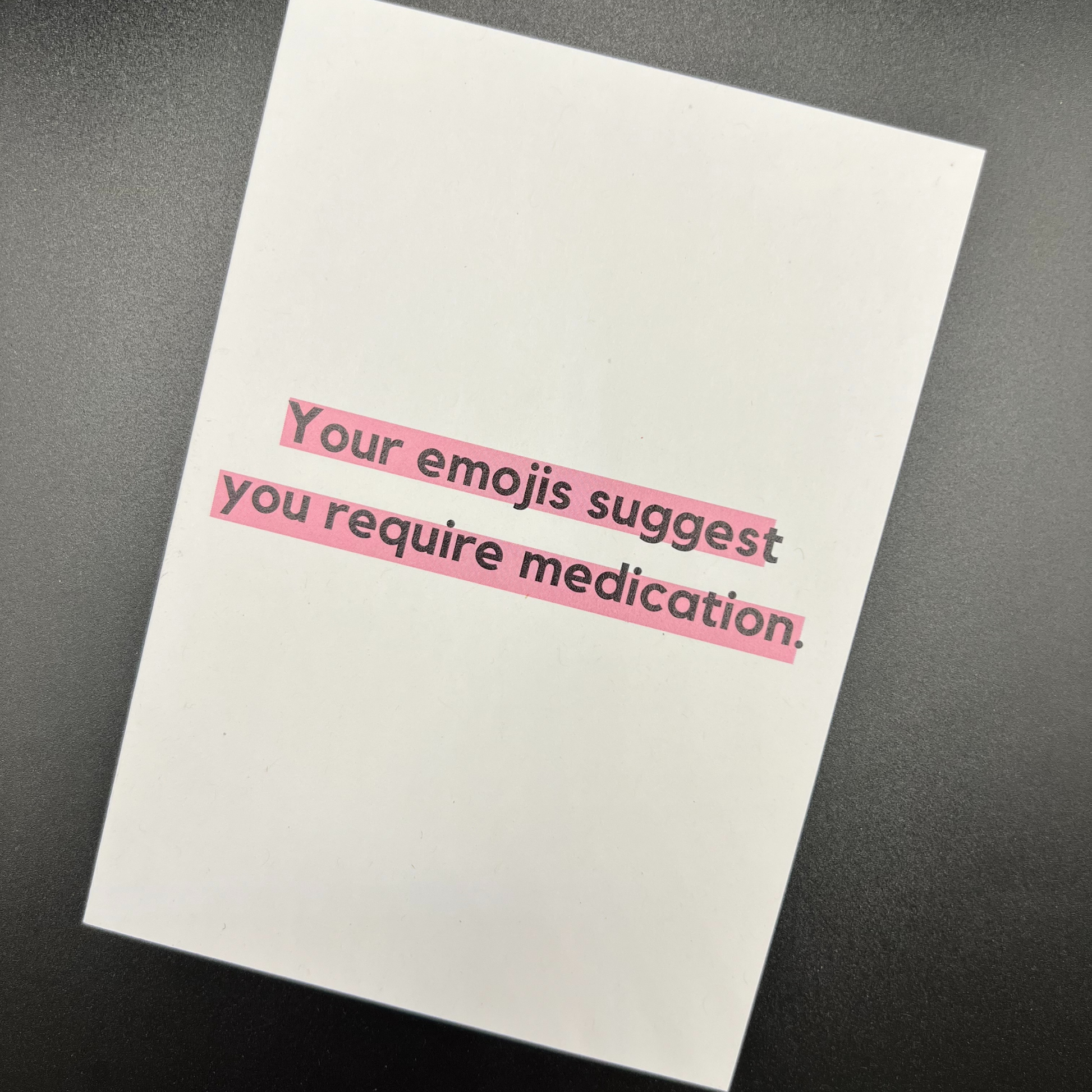 A white funny greeting card by The Mail Minx that says your emojis suggest you need medication.