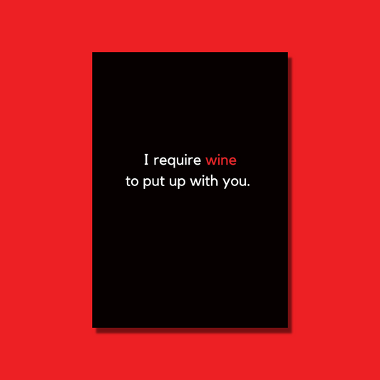 A bitchy card that is black with white and red text that says "I require wine to put up with you."